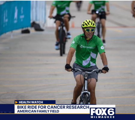 A bike rider from Associated Bank riding a bike at Audaxity