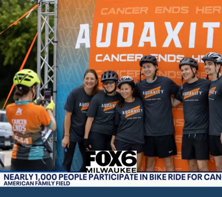Participants smiling for a photo at the Audaxity bike ride in Milwaukee